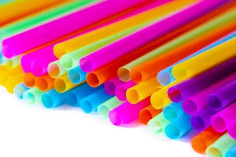 Colored plastic drinking straws on a white background Stock Photos