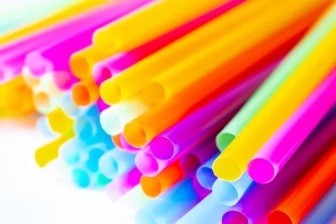 Colored plastic drinking straws on a white background Stock Photos