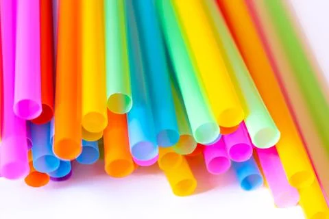 Colored plastic drinking straws on a white background Stock Photos