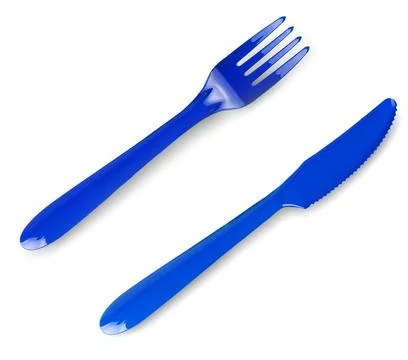 Colored plastic fork and knife isolated on white background. Stock Photos