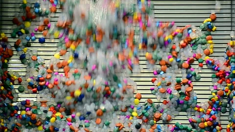 Colored plastic slices washed off by water, technology diversity, Stock Footage 89818002