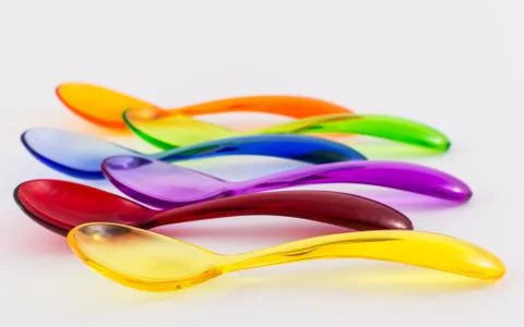 Colored plastic spoons Stock Photos