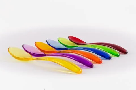 Colored plastic spoons Stock Photos