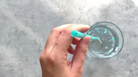 Colored plastic straws for drinking in a glass Stock Footage 243367604