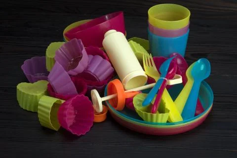 Colored plastic tableware Stock Photos