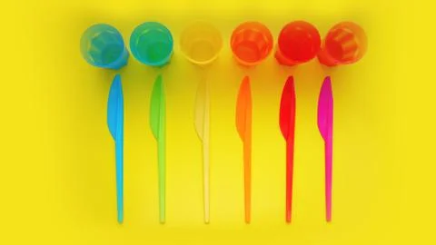 Colored plastic ware. Tableware for a picnic made of colored plastic. Stock Photos