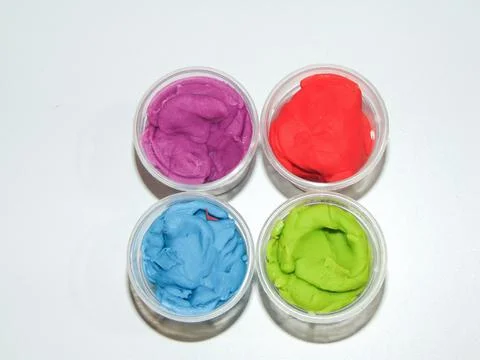 Colored plasticine isolated on white background Fotos Stock