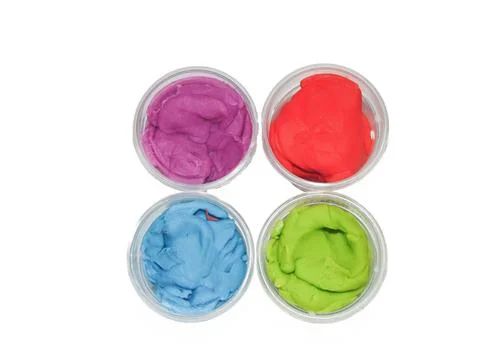 Colored plasticine isolated on white background Photos