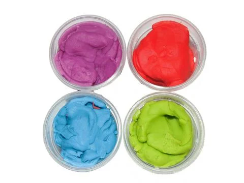 Colored plasticine isolated on white background Photos