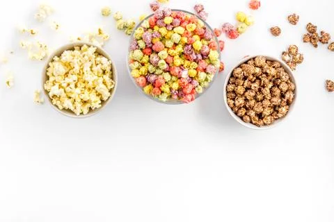 Colored popcorn in box on white background top view copy space Stock Photos