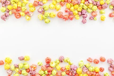 Colored popcorn on white background top view copy space Stock Photos