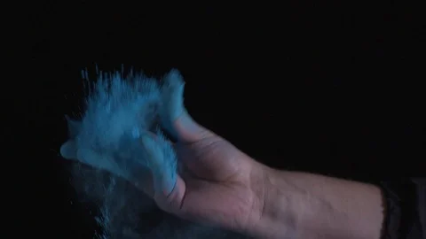 Colored Powder Is Exploded Against A Black Background Stock Footage 87477148