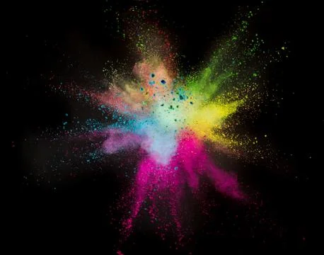 Colored powder explosion on black background. Stock Photos
