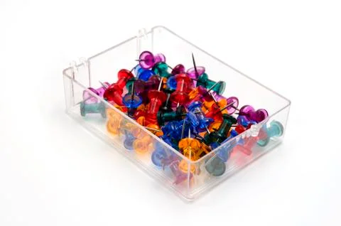 Colored push pins in a plastic box Stock Photos