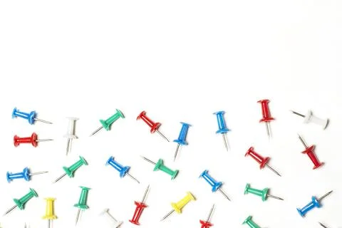 Colored pushpins on a white background with copy space Foto stock