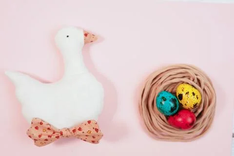 Colored quail eggs in the nest. Easter Stock Photos