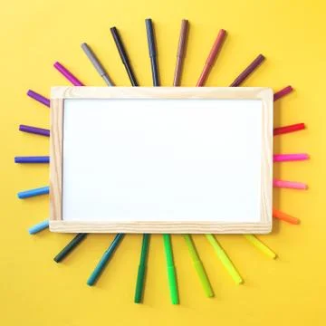 Colored rainbow gradient markers as sunshine on yellow Foto stock