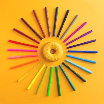 Colored rainbow gradient markers as sunshine and doughnut Stock Photos