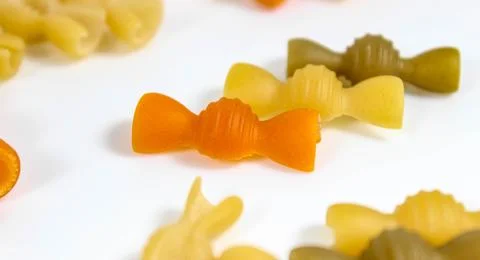 Colored raw pasta close-up. Macro. The horizontal frame. Stock Photos