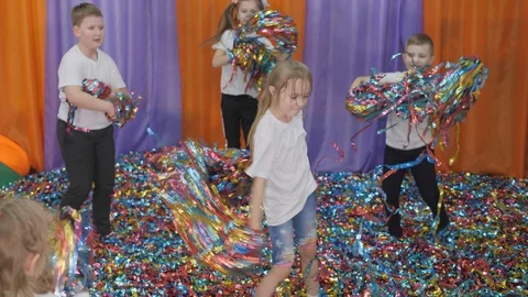 Colored ribbons fly in different directions. Bright children's emotions Stock Footage 127992988