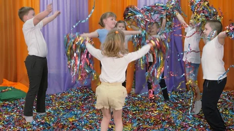 Colored ribbons fly in different directions. Bright children's emotions Stock Footage 127993365