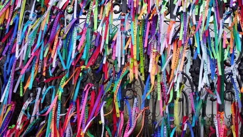 Colored ribbons tied in the railing of the Church of Our Lord of Bonfim Stock Footage