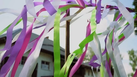 Colored ribbons on a wedding arch. Summer weather, ribbons beautifully develop Stock Footage 117134034