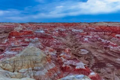 Colored rock formation against blue sky at Wucaitan (Five Colored Hills) Stock Photos