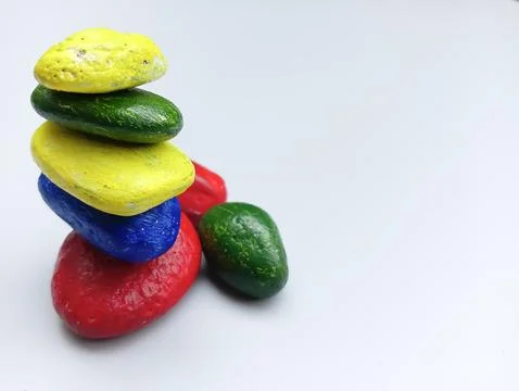 Colored rocks on white background  Foto stock