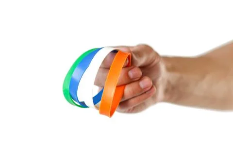 Colored rubber bracelets on the arm. Close up. Isolated on white background Stock-Fotos