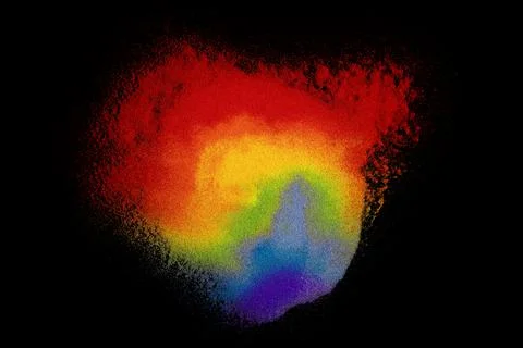 Colored sands on black background Stock Photos