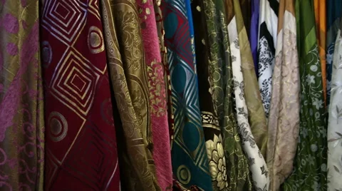 Colored scarves on the rack weigh Stock Footage 61051633