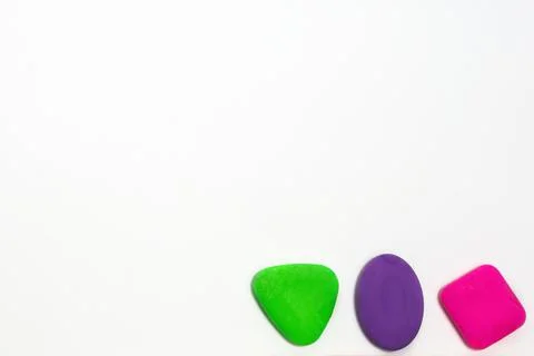 Colored school erasers on a white background. School supplies and stationery  Stock Photos