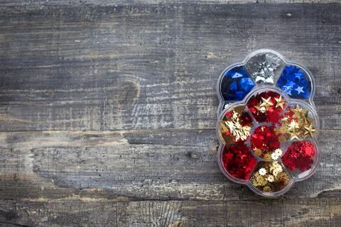 Colored sequins in two boxes Stock Photos