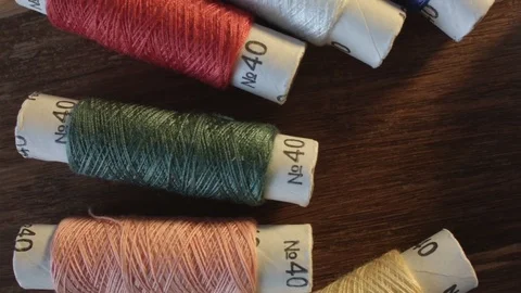 Colored sewing threads on the table Vídeos de archivo 79539786