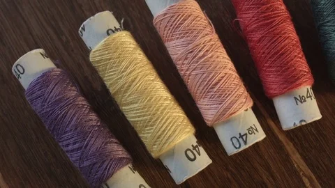 Colored sewing threads on the table 스톡 동영상 79541662