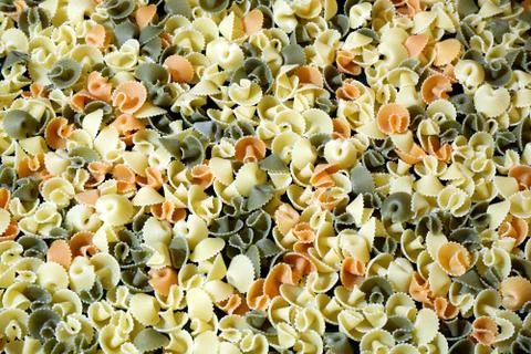 Colored shells pasta close up background 스톡 사진