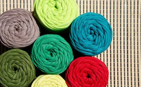 Colored skeins of thread for weaving macrame. Stock Photos