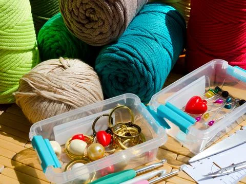 Colored skeins of thread for weaving macrame and boxes with accessories. Stock Photos