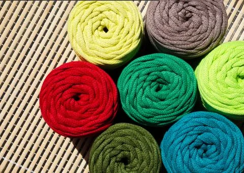 Colored skeins of thread for weaving macrame. Stock Photos