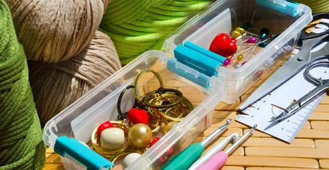Colored skeins of thread for weaving macrame and boxes with accessories. Stock Photos