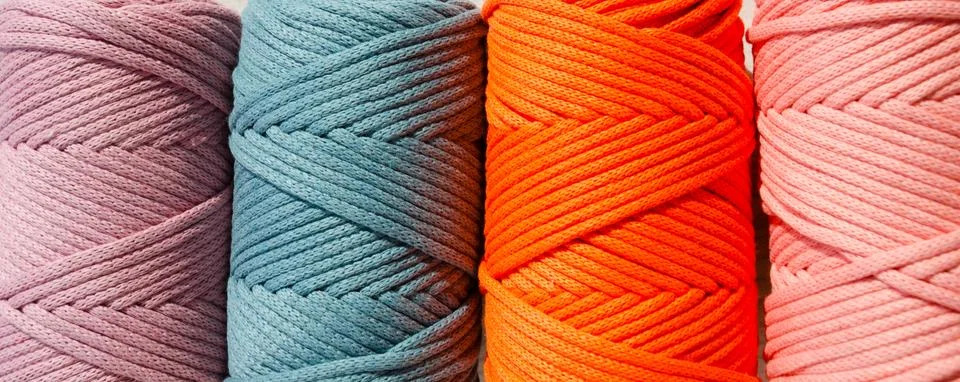 Colored skeins of thread for weaving macrame close-up. Stock Photos