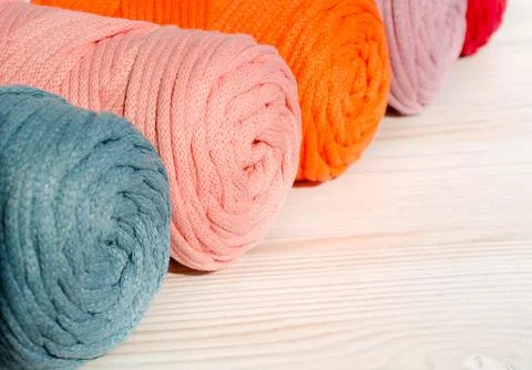 Colored skeins of thread for weaving macrame close-up. Stock Photos