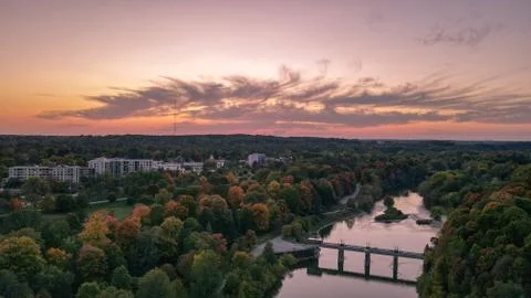 Colored sky sunset over river in autumn Stock Photos