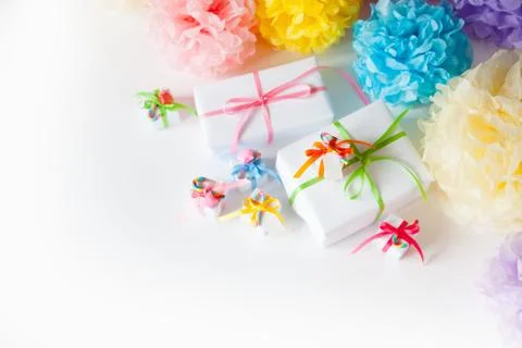 Colored small gift boxes with colorful ribbons. Stock Photos