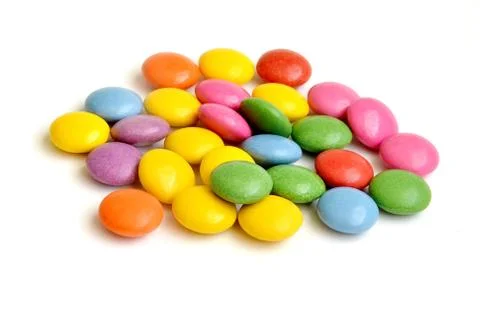Colored smarties on white background Stock Photos