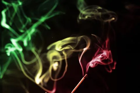 Colored smoke on a black background Stock Photos