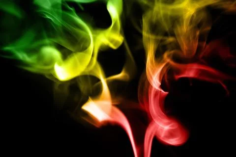 Colored smoke on a black background Stock Photos