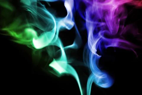 Colored smoke on a black background Stock Photos