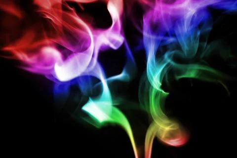 Colored smoke on a black background Stock Photos
